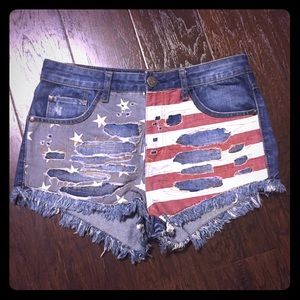 High rise distressed denim flag shorts